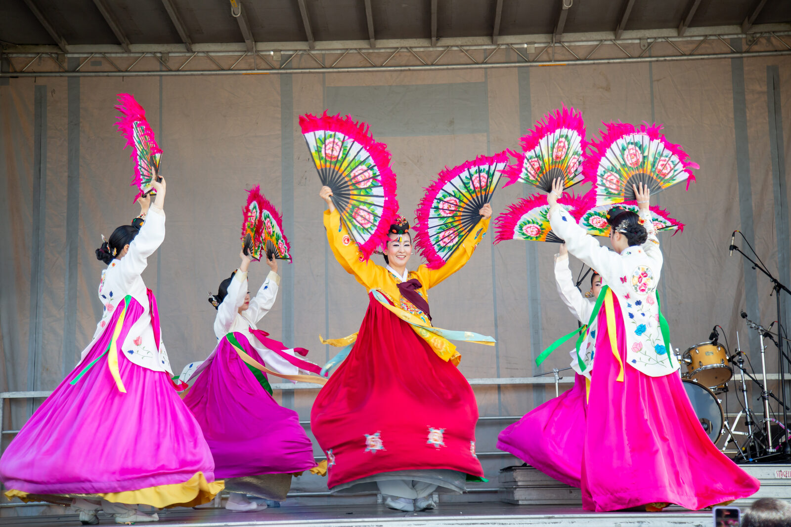 Traditional Korean fan dancers performing in bright hanbok